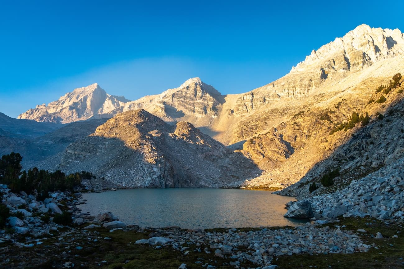Sunrise on Dade peak above upper Treasure Lake in the Little Lakes Valley in the Sierras.  Photo by Brock Dallman