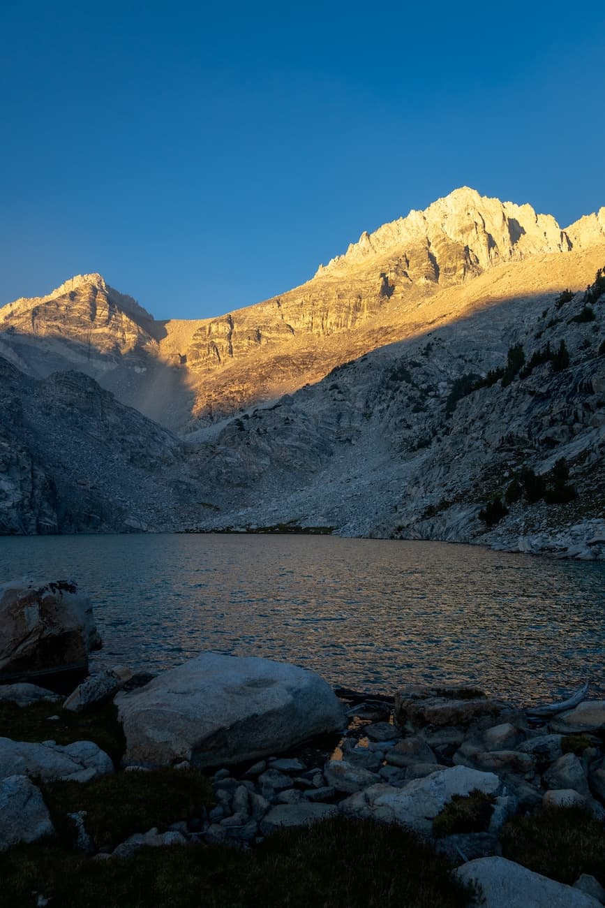 Sunrise on Dade peak above upper Treasure Lake in the Little Lakes Valley in the Sierras.  Photo by Brock Dallman