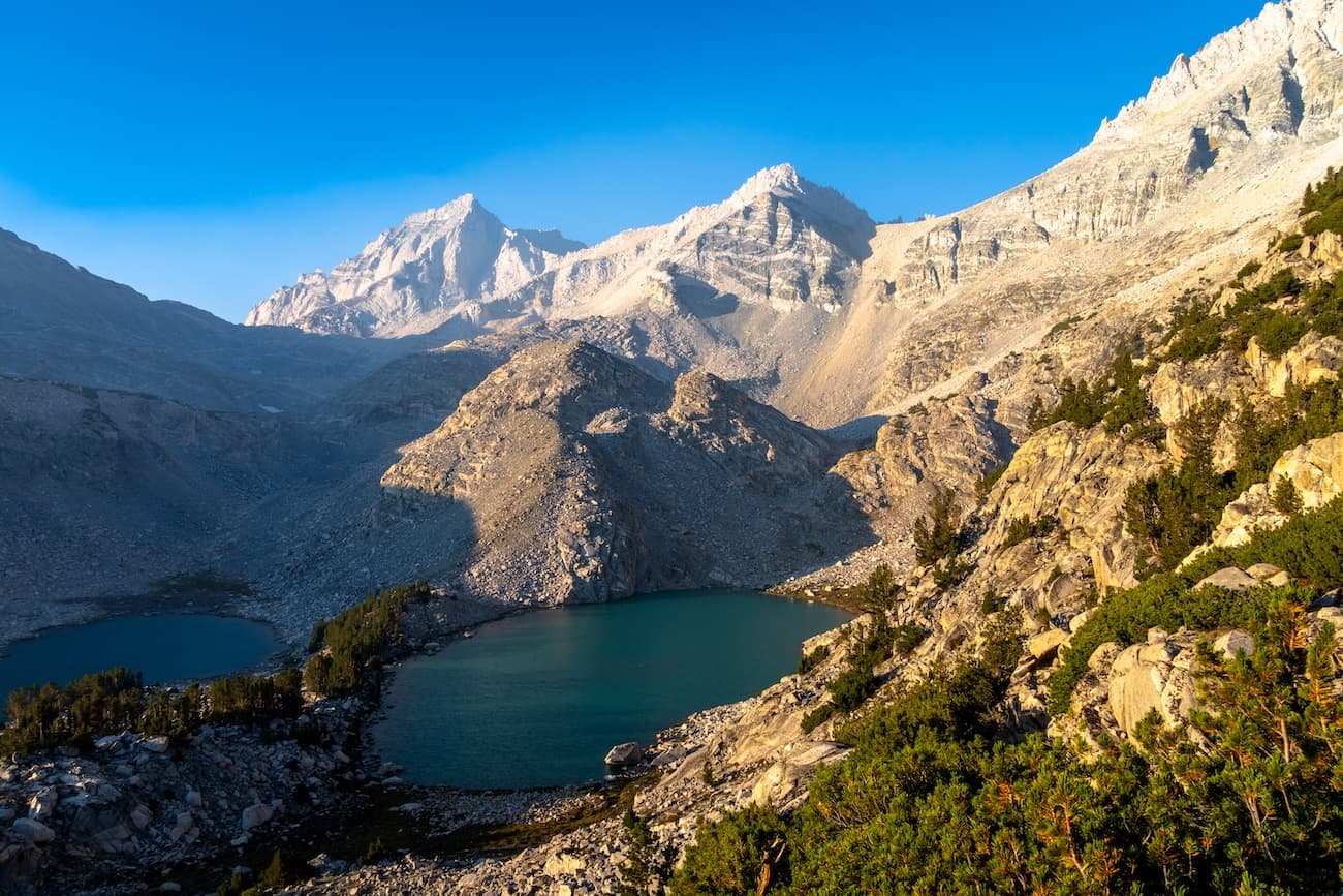 Sunrise on Dade peak above upper Treasure Lake in the Little Lakes Valley in the Sierras.  Photo by Brock Dallman