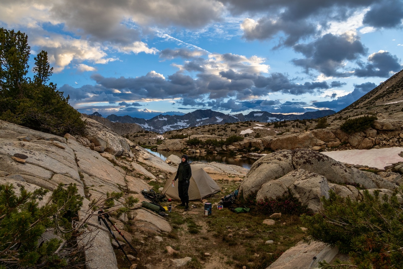 Sam Stych and our Big Agnes tent at a lake in the Dusy Basin of Kings Canyon National Park in the Sierras