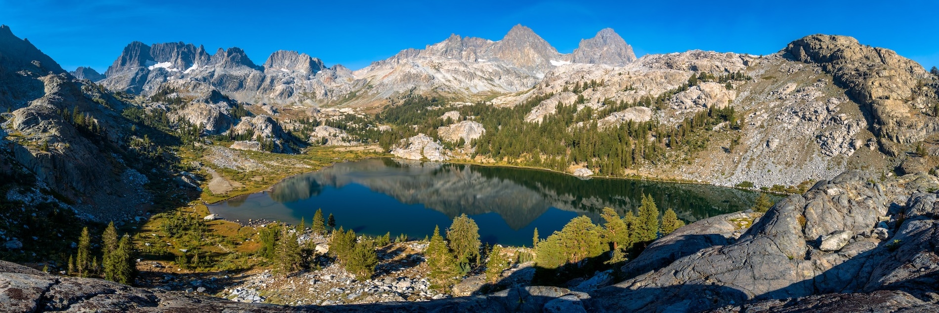 Epic panorama of Ediza Lake in the Sierras. Photo by Brock Dallman