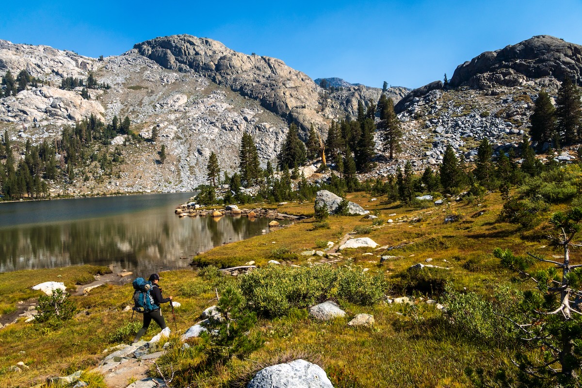 Sam Stych hiking near the shore of Ediza Lake in the Sierra